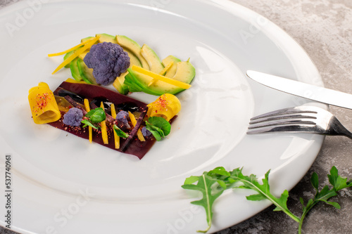 Dish with avicado, broccoli and herbs. Vegan cuisine. Detox menu photo