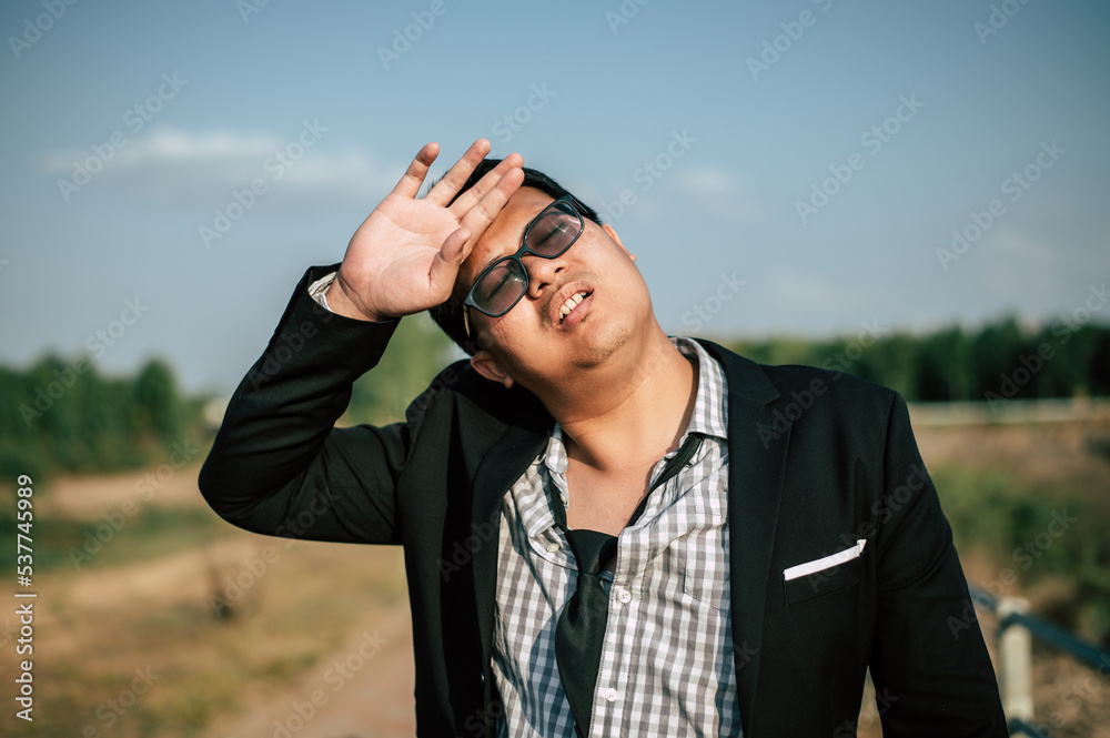 Asian Businessman tired and sleeping for relaxing at outdoors Asian Businessman tired and sleeping for relaxing at outdoors
