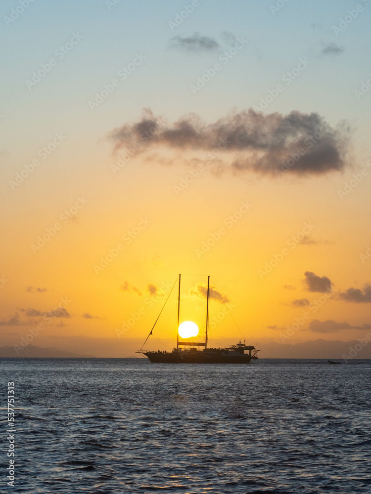 Double masted yacht at sunset