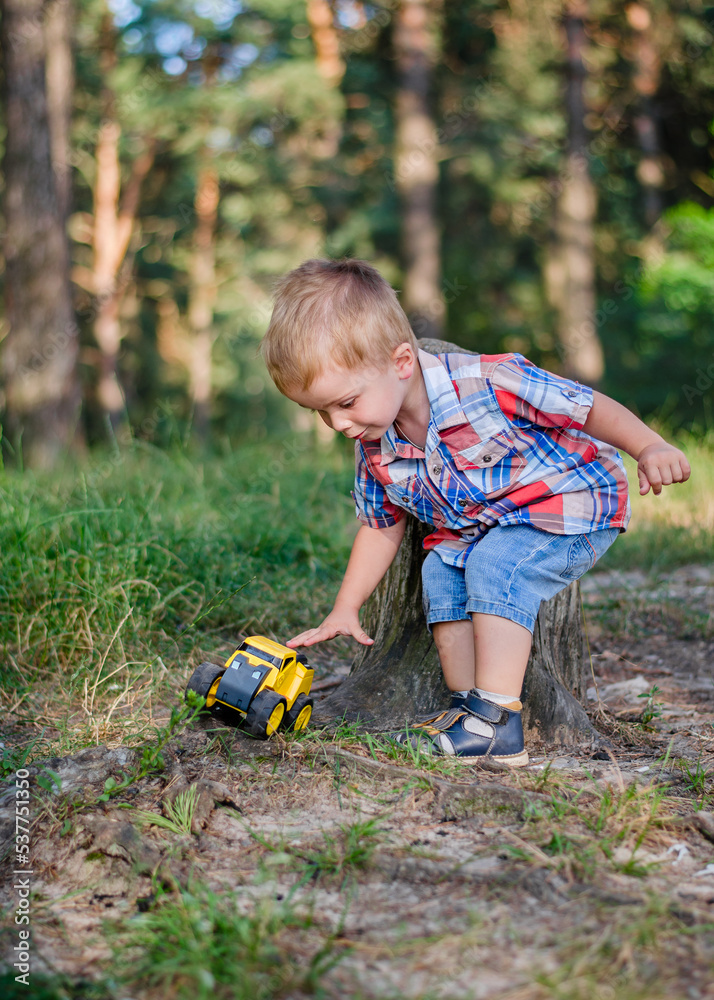 Blond boy 2 years old in the forest Blond boy 2 years old in the forest