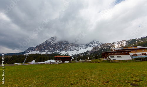 Scenic view of snow capped mountain peaks of Karawanks from Sinacher Gupf in Carinthia, Austria. Mount Hochstuhl (Stol) is visible through dense forest in early spring. Rosental on sunny day. Freedom photo