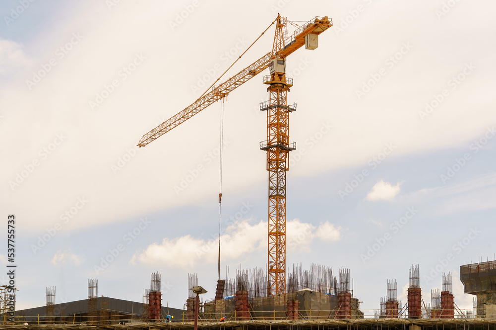 Crane .Construction site whit machine or crane with blue sky background	