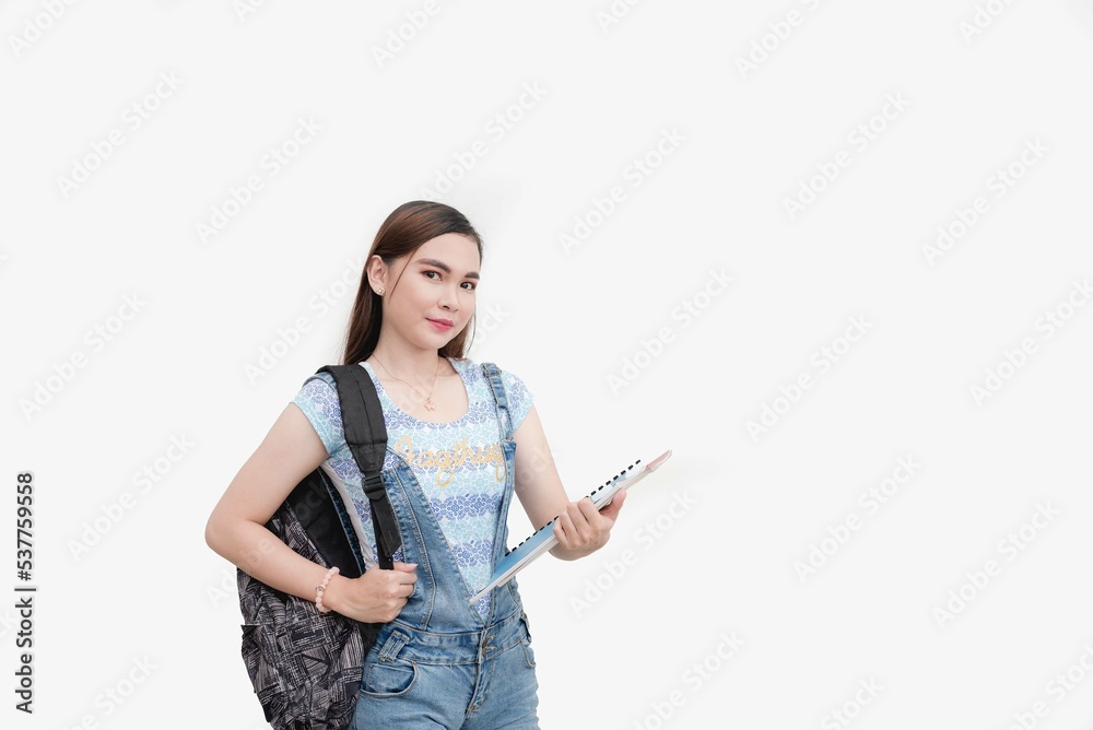 A senior high school student carries a black backpack and holds two sliding folders in her arm. Studio shot isolated white background. A senior high school student carries a black backpack and holds two sliding folders in her arm. Studio shot isolated white background.