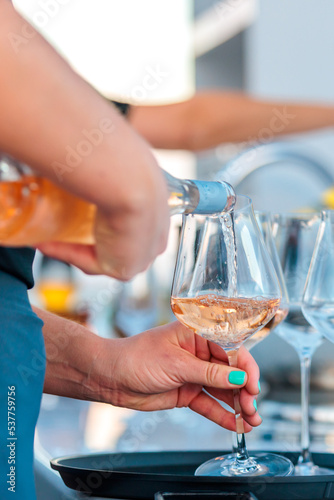 Savor the Moment with a Glass of Rose Wine Being Served at Your Next Event