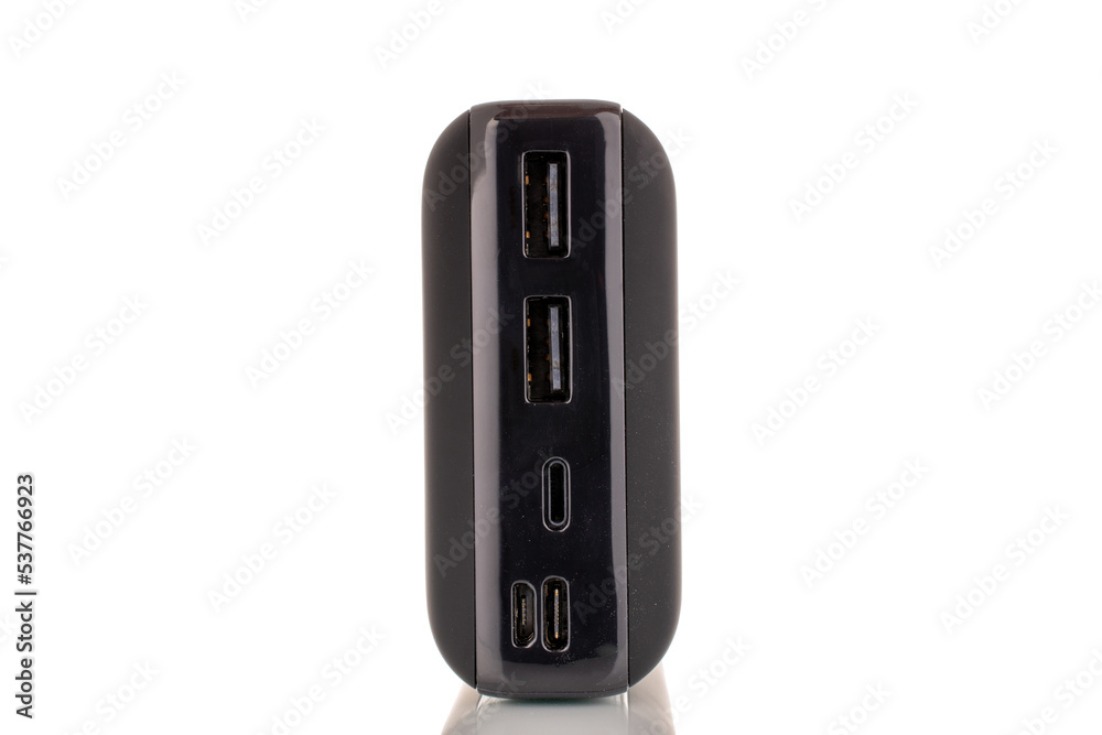 One new black portable battery, macro, isolated on white background. One new black portable battery, macro, isolated on white background.