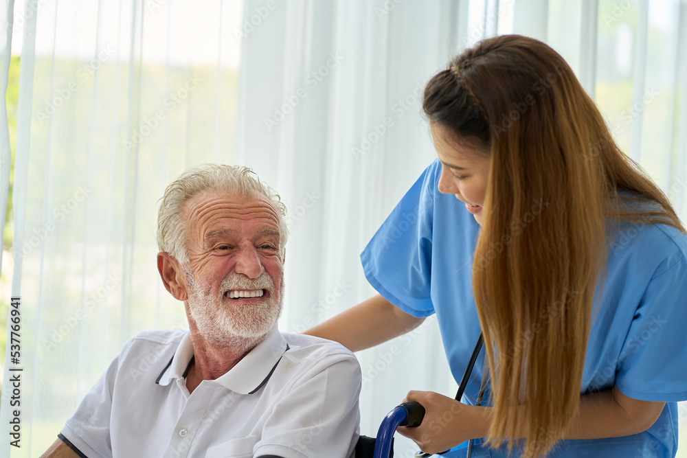 Obraz premium Happy scene for Home healthcare service , Grand Pa oldy man smile on wheelchair with smiling nurse in home