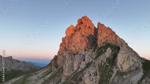 Aerial video of the sunrise in the Dolomites mountains. It was shot on the beautiful meadows of Seiser Alm plateau with fog and mist in the morning. Epic landscape in European Alps wanderlust. photo