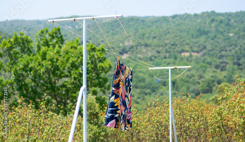 Obraz na płótnie A towel dries on a rope at a mountain landscape, Pyrenees, France w salonie