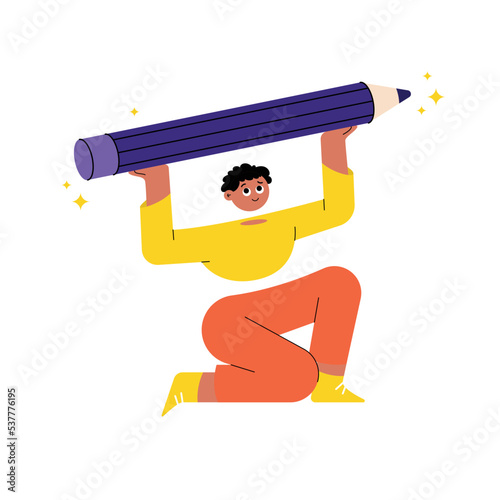 Young man holding big pencil
