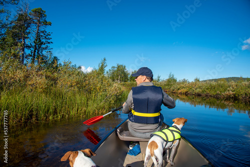 Canoeing on the river in Finland © Monika