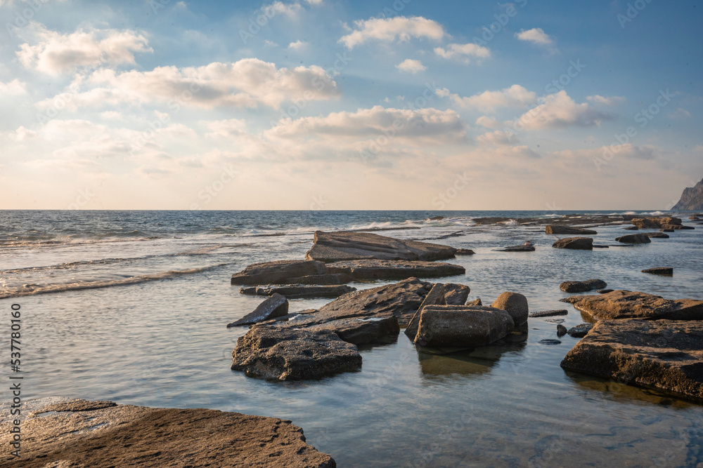 Beautiful seascape at sunset with rock formations in the water Beautiful seascape at sunset with rock formations in the water