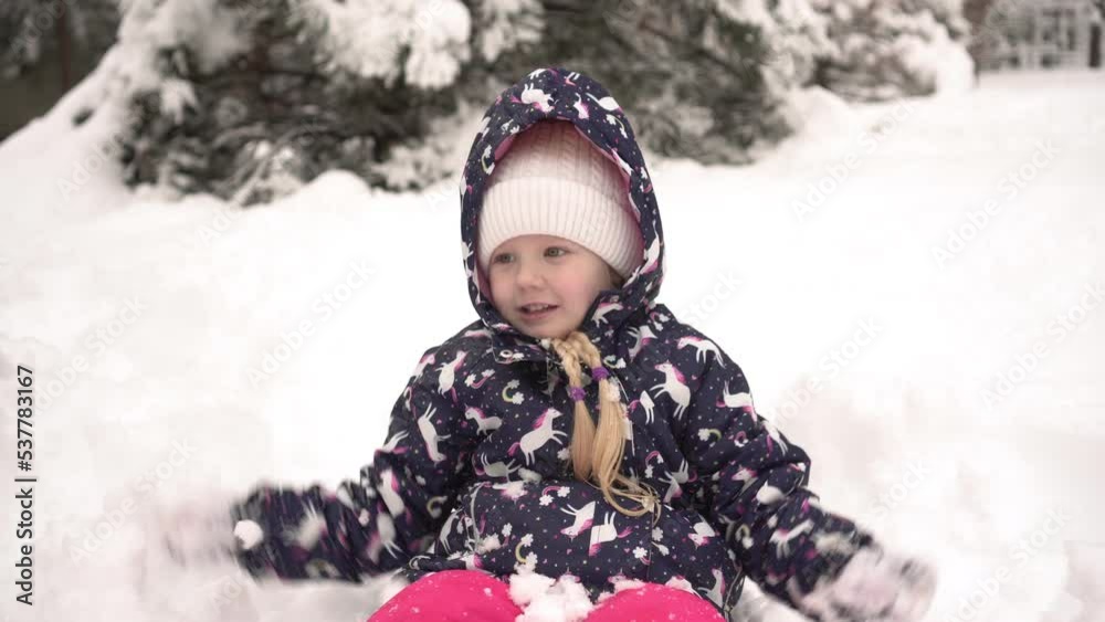 Child girl 5 years old plays snowballs in winter Child girl 5 years old plays snowballs in winter