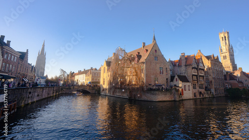 Rozenhoedkaai in Brugge , panoramic view along the canal and medieval buildings in old town during winter sunny day : Brugge , Belgium : November 30 , 2019
