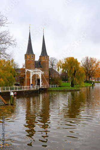The Eastern gate in Delft , Brick Gothic northern European architecture gate and towers during autumn , winter : Delft , Netherlands : November 28 , 2019