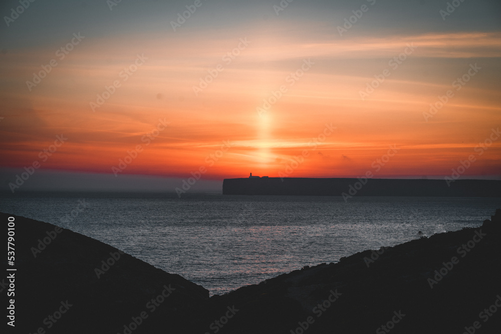 mystical sunset by the sea with a section of coast mystical sunset by the sea with a section of coast