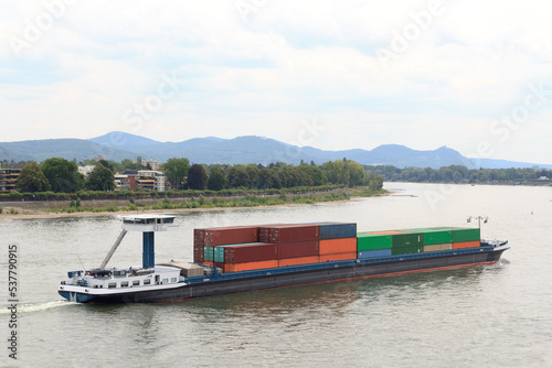 Container ship on river Rhine (Rhein) in Bonn, Germany