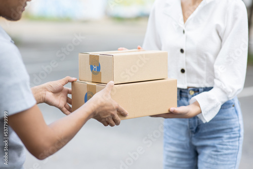 Parcel delivery, postage, people and delivery ideas. © Witoon