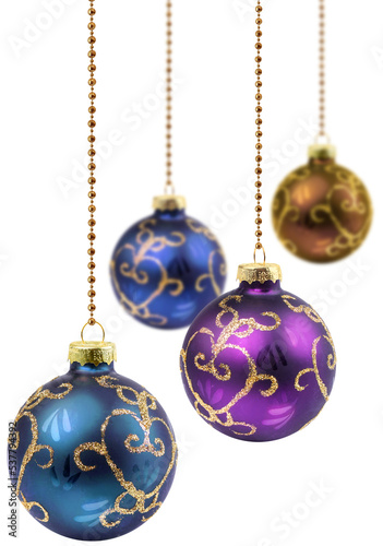 Four retro color Christmas balls hanging isolated, selective focus