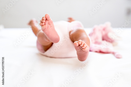 New Born Baby Feet on White Blanket - parenting or love concept