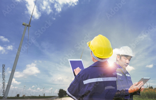 Team of Engineer people working in wind turbine and industrial with double exposure. Concept engineers.