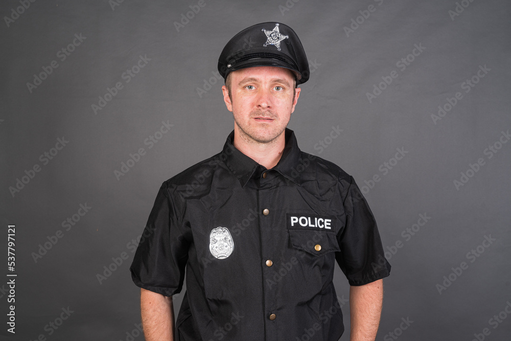 Portrait of Caucasian man wearing police uniform costume Portrait of Caucasian man wearing police uniform costume