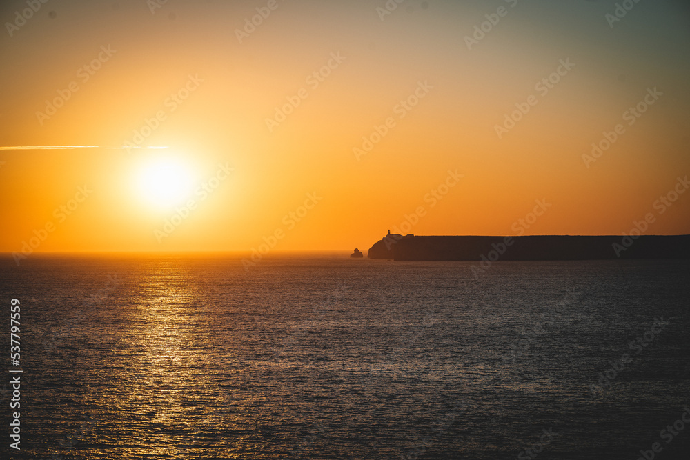 mystical sunset by the sea with a section of coast mystical sunset by the sea with a section of coast
