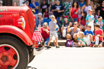 Small Town Fourth of July Parade, Vintage Firetruck with American Flags