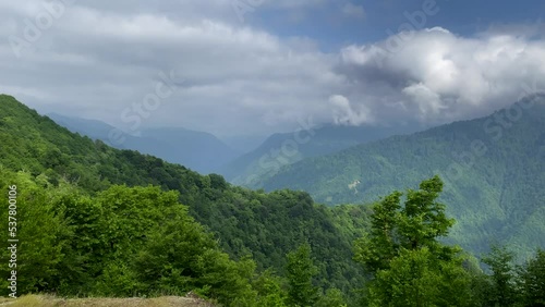 Mountains aesthetic panorama view from above. Peak of Archangel mountain in Adjara, Georgia. Mtirala nation park. Blue sky with clouds