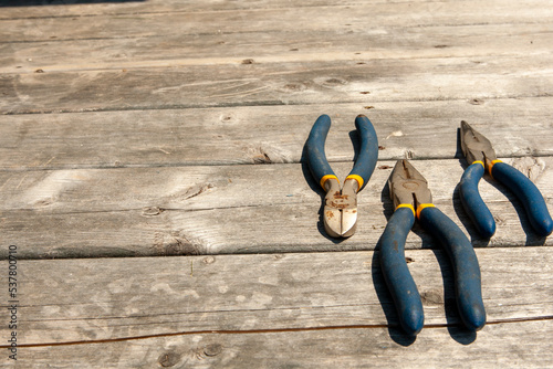 flat lay of wrenches on weathered deck floor
