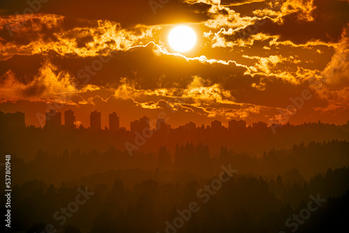 Urban cityscape silhouette on sunset sky background © Imagenet