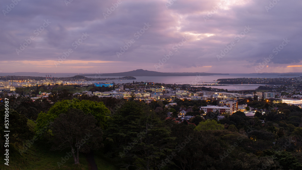 Dawn view of Auckland with mountain on the background.