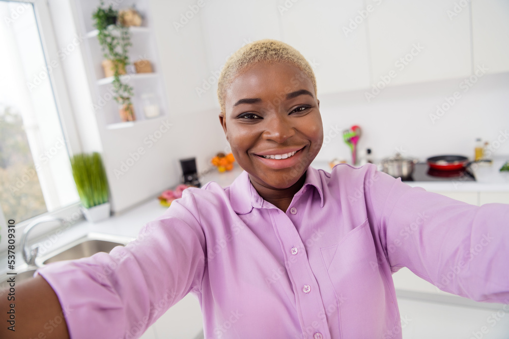 Photo of cheerful friendly girl make selfie recording video toothy smile enjoy free time weekend indoors Photo of cheerful friendly girl make selfie recording video toothy smile enjoy free time weekend indoors