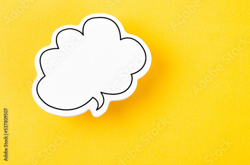 The Speech bubble with copy space communication talking speaking concepts on yellow background. photo