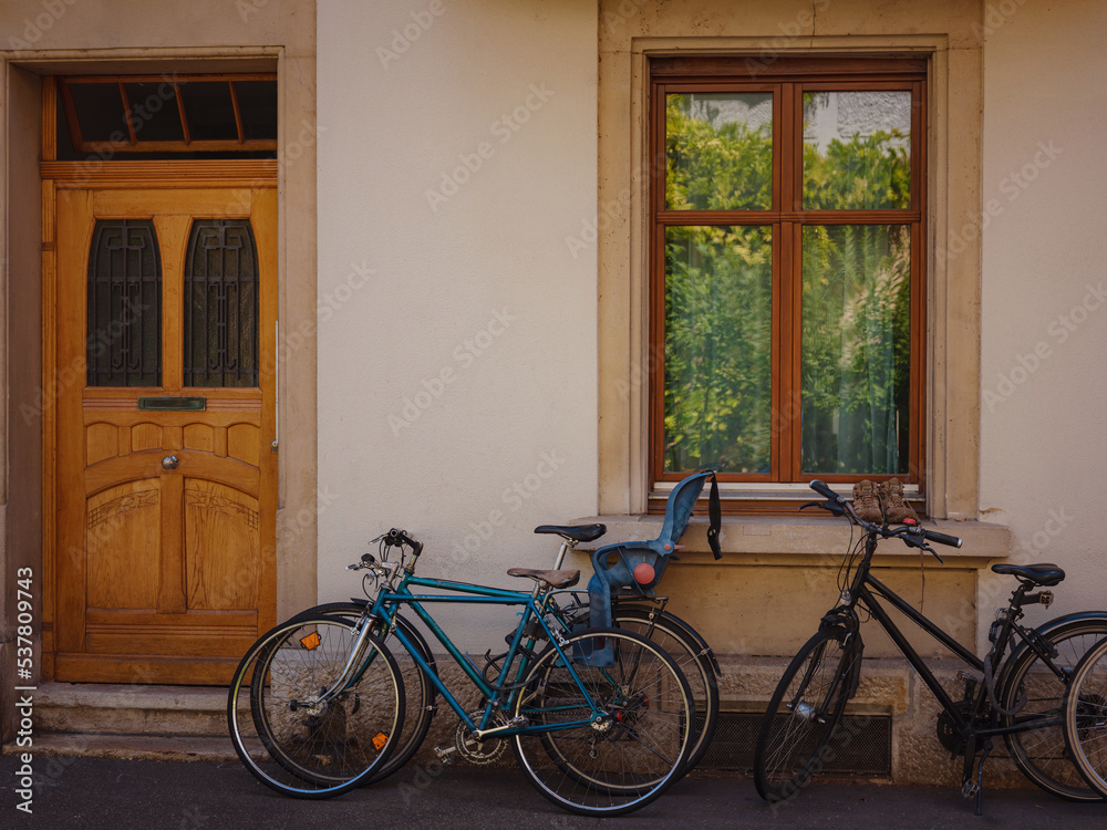 Buildings in the city centre of Basel , Switzerland. Colorful house with bike near entrance