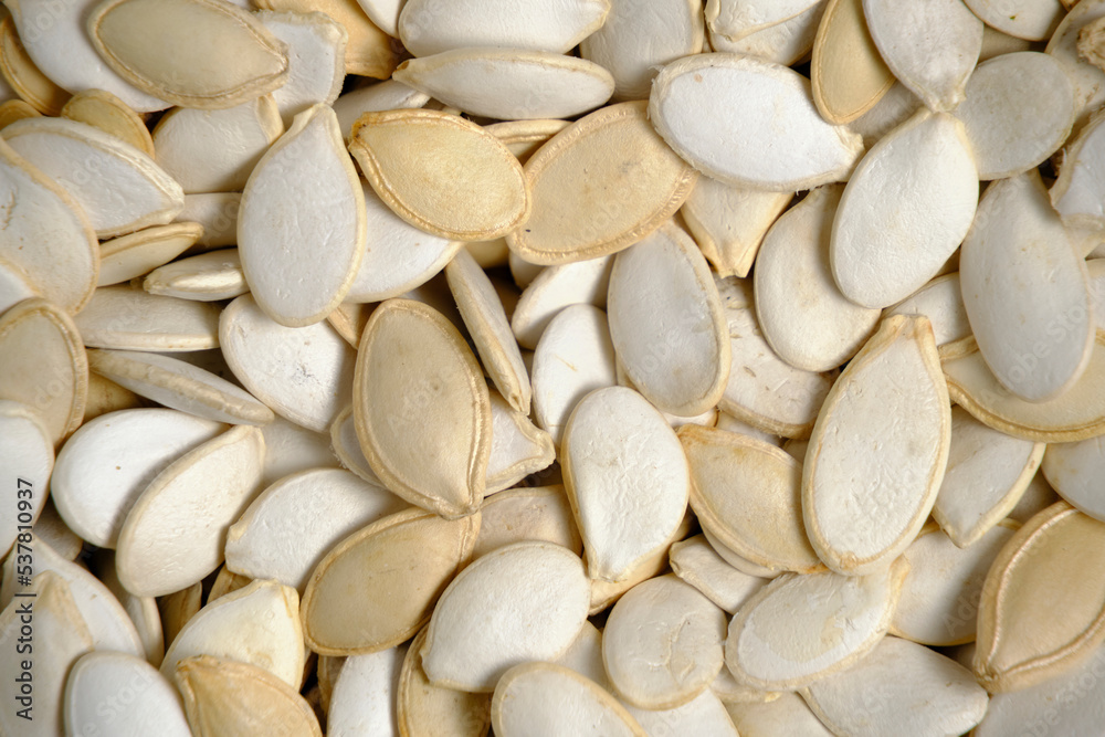 Background, unpeeled pumpkin seeds closeup. Background, unpeeled pumpkin seeds closeup.