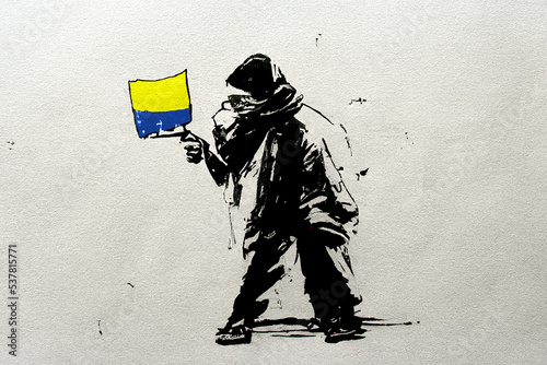 Fotografia Graphic graffiti stencil ink artwork featuring a protestor standing alone with a flag of Ukraine