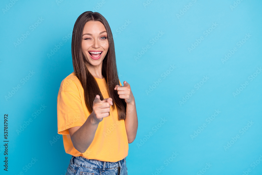 Photo of cheerful positive lady laughing point two arm fingers you say hello hi isolated on blue color background Photo of cheerful positive lady laughing point two arm fingers you say hello hi isolated on blue color background