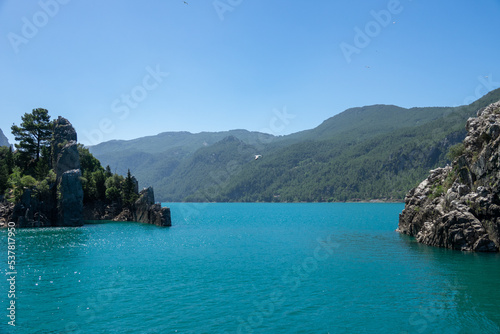 View of the lake with clear turquoise water and on the mountain cliffs of the Green Canyon. Manavgat, Antalya, Turkey