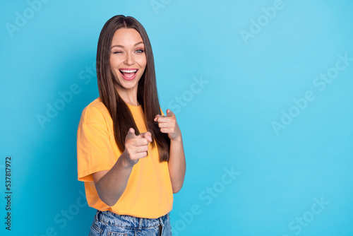 Photo of cheerful positive lady laughing point two arm fingers you say hello hi isolated on blue color background