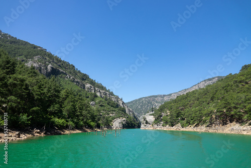 View of the lake with green water and on the mountain cliffs of the Green Canyon. Landscape of Green canyon, Manavgat, Antalya, Turkey © Goldream