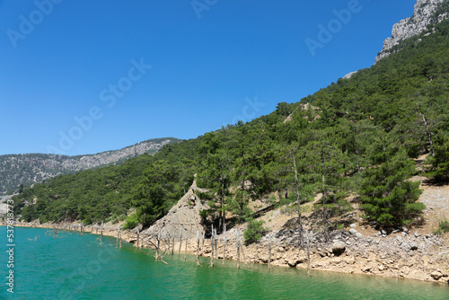 View of the lake with green water and on the mountain cliffs of the Green Canyon. Landscape of Green canyon, Manavgat, Antalya, Turkey photo