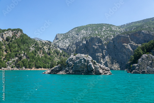 View of the lake with clear turquoise water and on the mountain cliffs of the Green Canyon. Landscape of Green canyon, Manavgat, Antalya, Turkey © Goldream