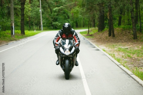 Sport Biker Racing on Road