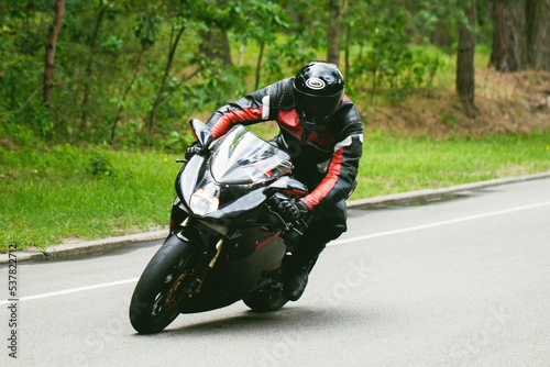 Sport Biker Racing on Road