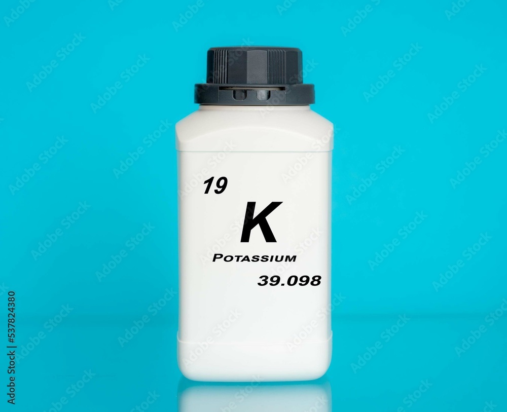Potassium K chemical element in a laboratory plastic container