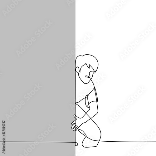 man crouched down and looks out from behind the wall - one line drawing vector. concept to peep, spy
