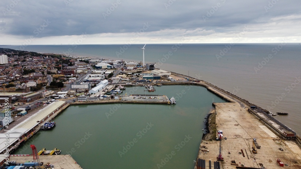 Aerial view of Lowestoft harbour and port with boats docked and far reaching views. Lowestoft England. 