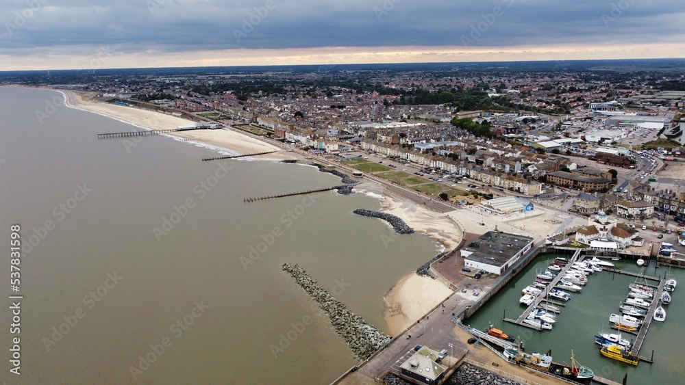 Aerial view of Lowestoft harbour and port with boats docked and far reaching views. Lowestoft England. 