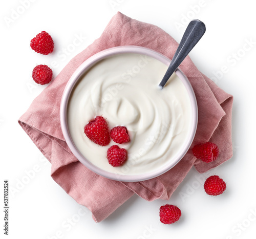 Pink bowl of greek yogurt and fresh raspberries on linen napkin isolated on white background