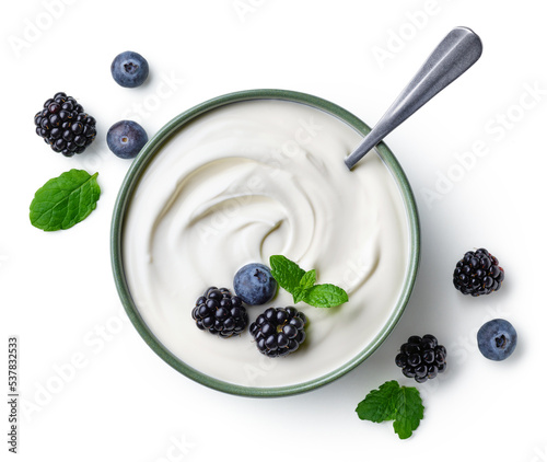 Green bowl of greek yogurt and fresh berries isolated on white background